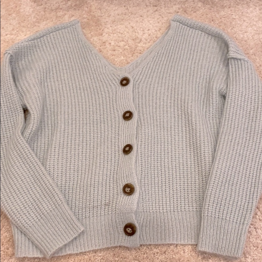 A blue cardigan.